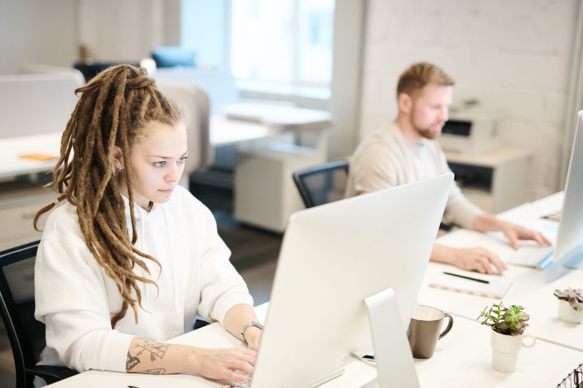 Two colleagues working through a task