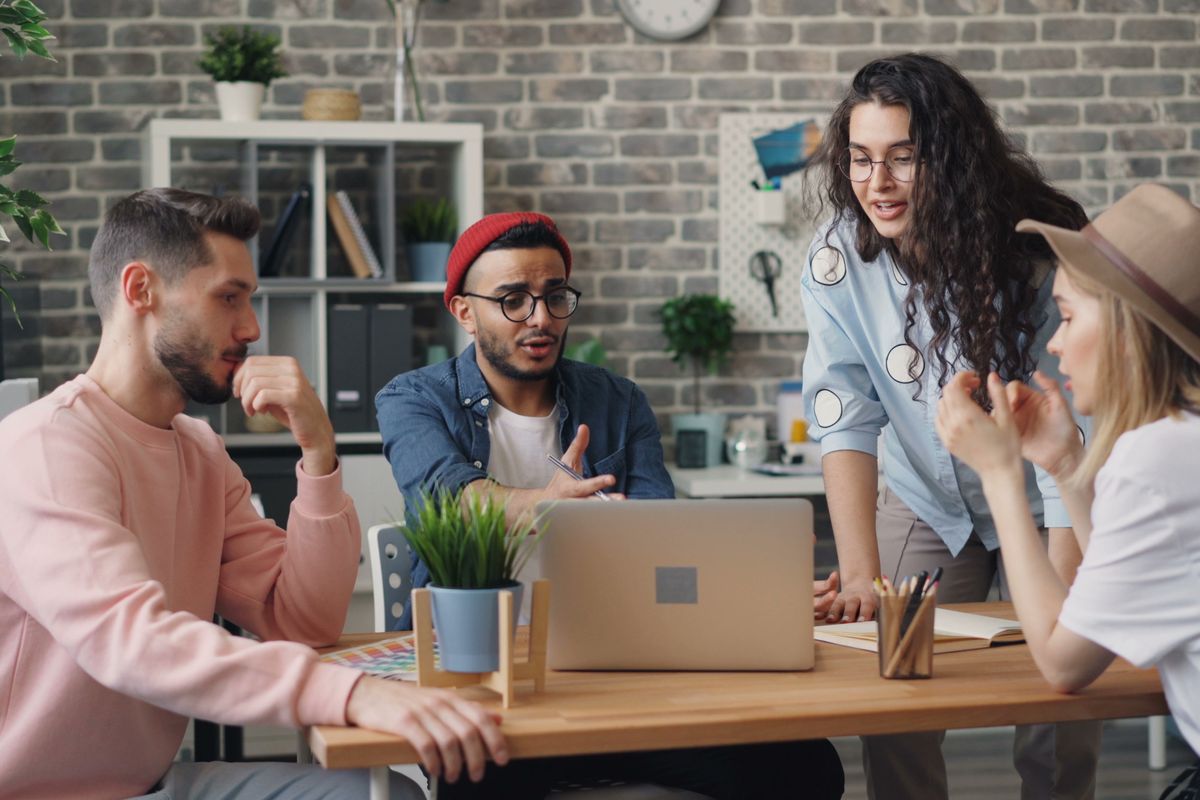 Colleagues working together at a desk