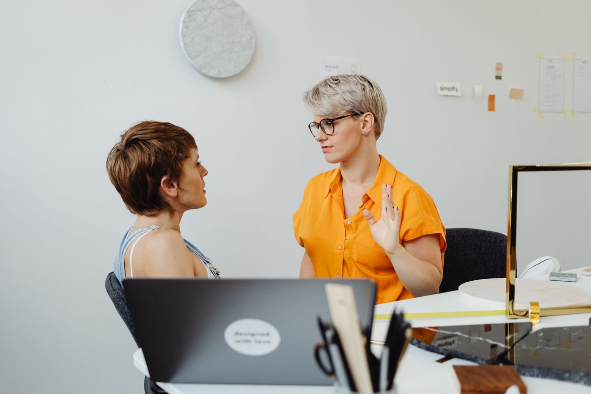 Colleagues working together at a desk